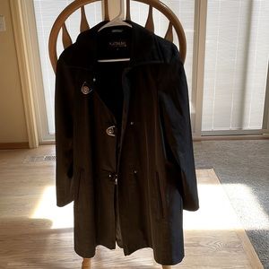 Like new beautiful thigh length coat. Polyester/Spandex material.